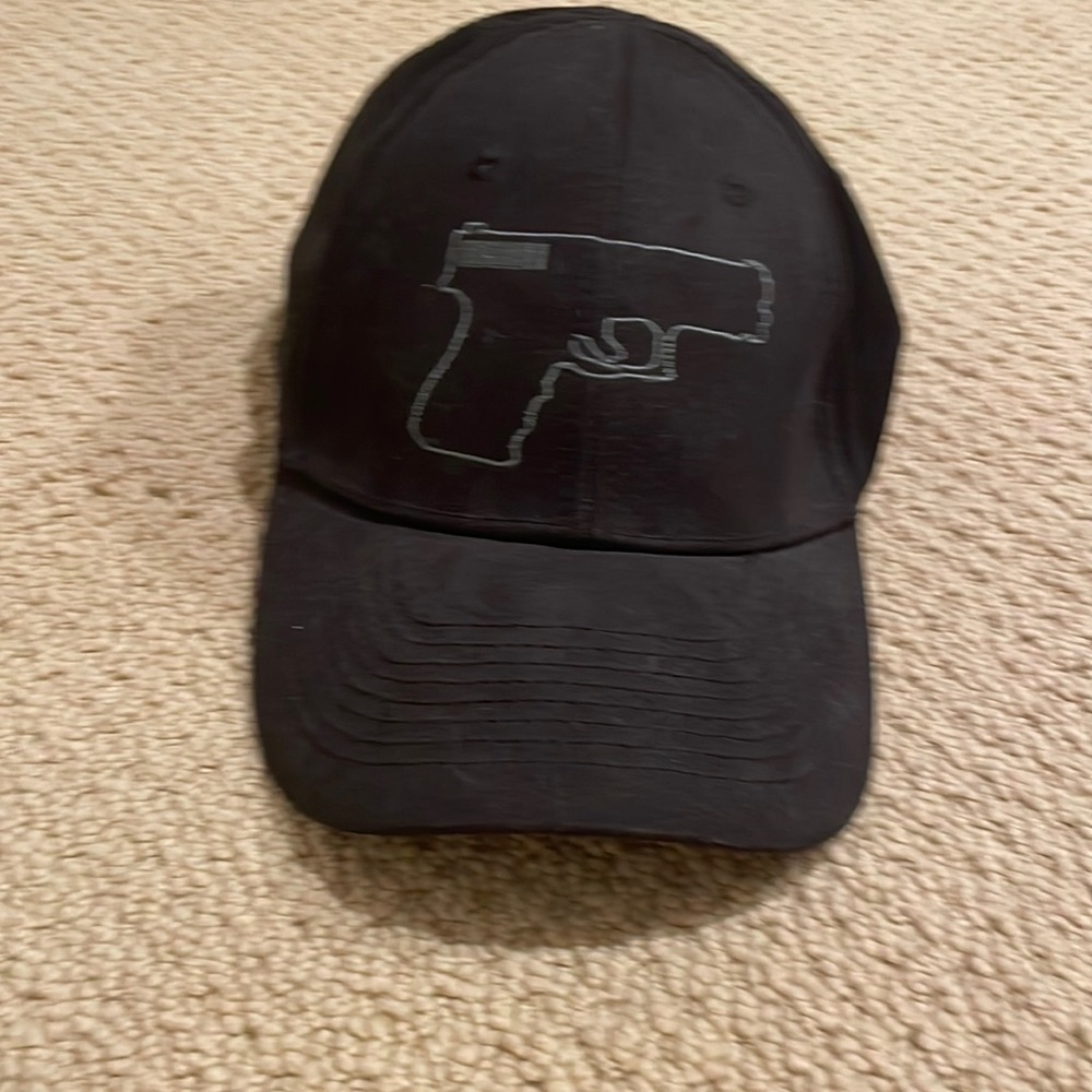 black hat with gun detail in front
